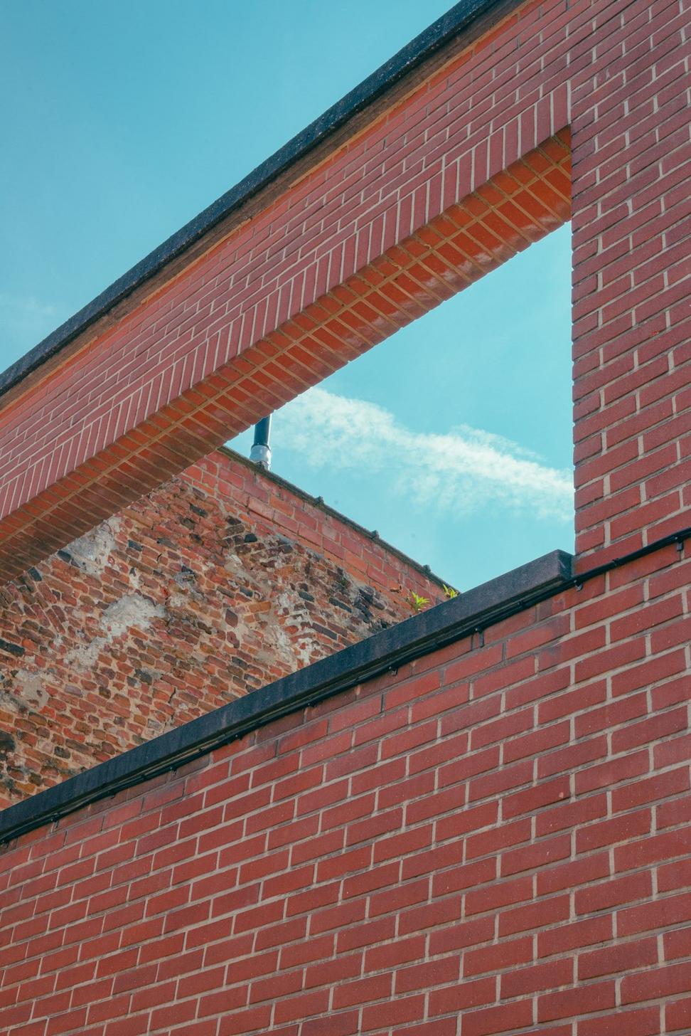 Studio interior with exposed brick and steel beams